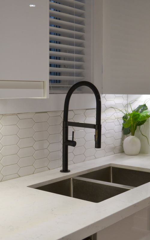 Basement staircase with new railing and lighting