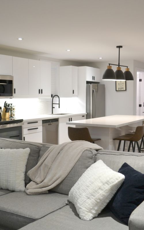 Basement bedroom with natural light and neutral decor